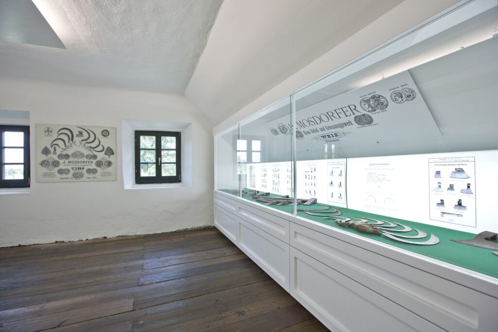 Display case with old sickles that Mosdorfer used to produce